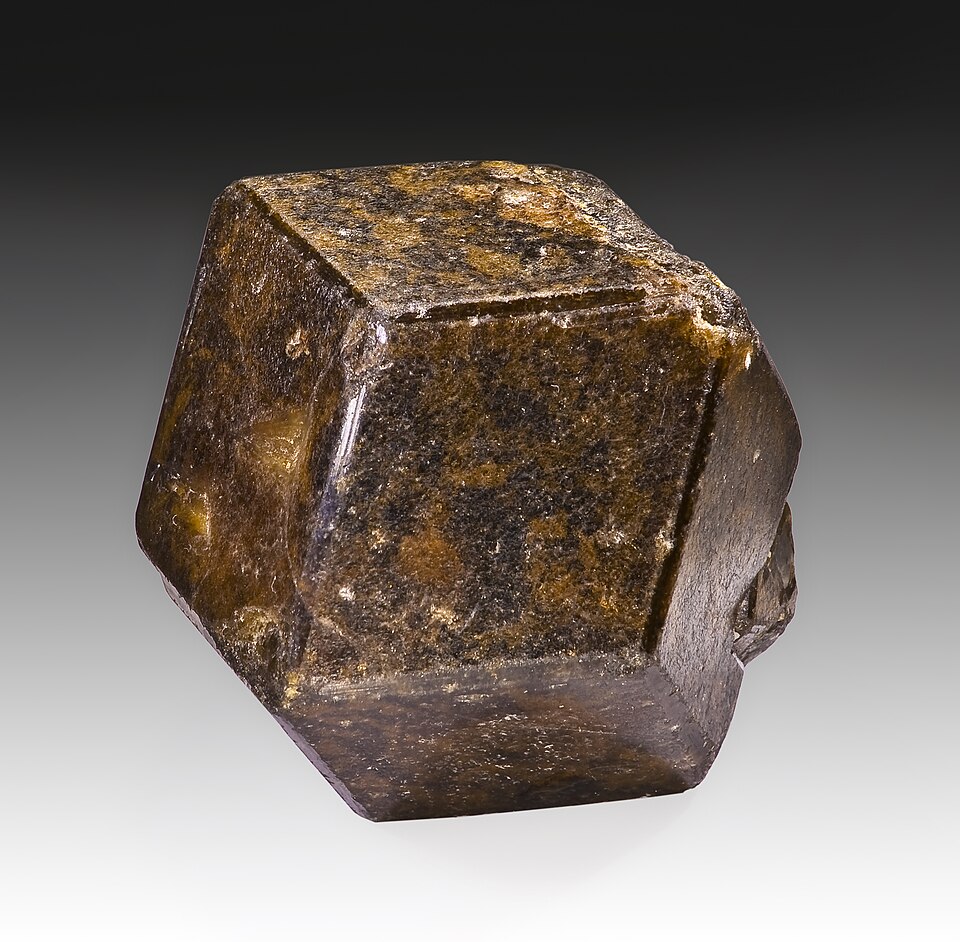 Andradite specimen Andradite specimen: yellow-green (demantoid) and brown mineral