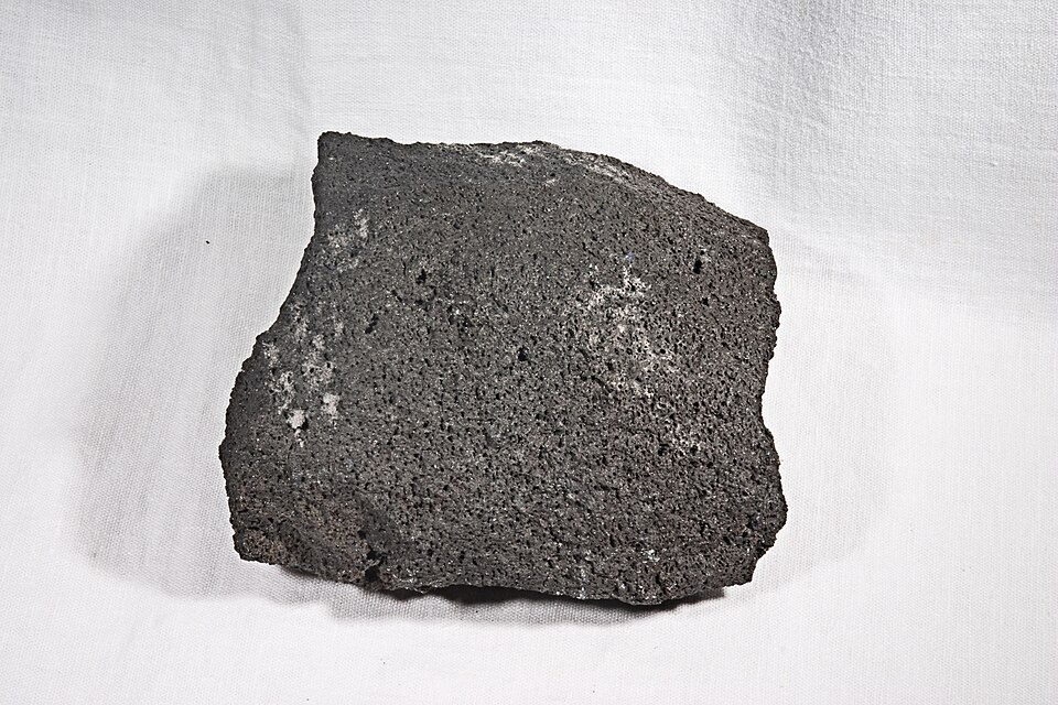 Basaltic Andesite specimen: dark gray and black igneous rock