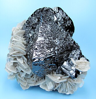 Cassiterite specimen: brown and black mineral