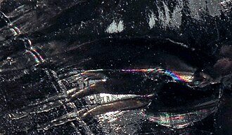Obsidian specimen: black and brown igneous rock