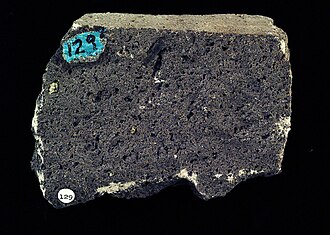 Tephrite specimen: dark gray and black igneous rock